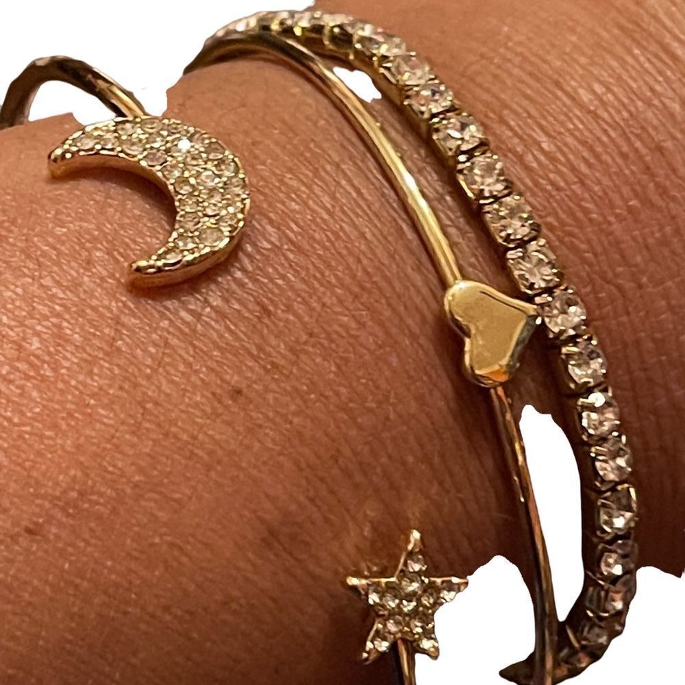Costume jewelry set of three gold tone bracelets